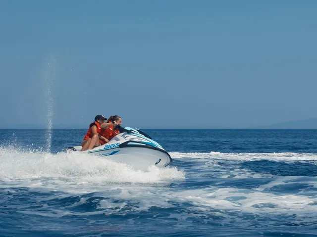 Couple kicking up spray