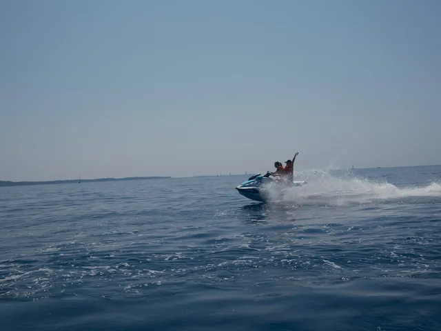 Couple kicking up spray