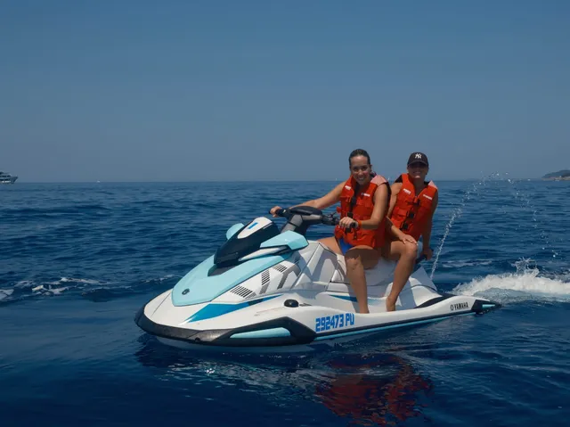 Couple close to a Yamaha jet ski