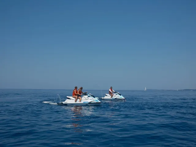 Couple equipment on glassy sea