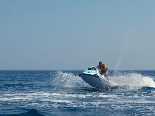 Jet ski jumping off a wave