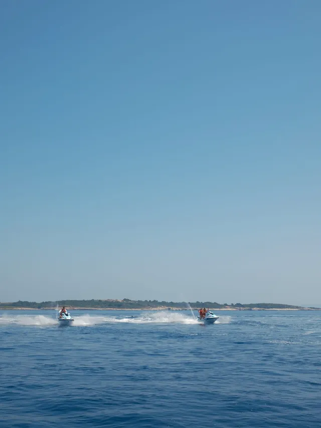 Couple sailing on the open ocean