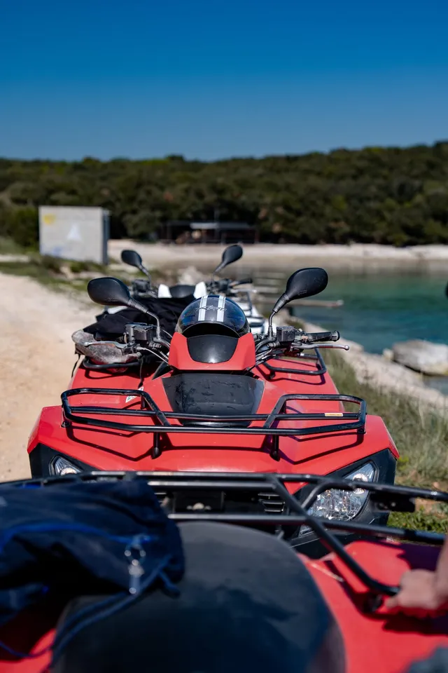 Quads lined along a coastal path