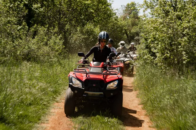 Wide shot of a quad safari group on a trail