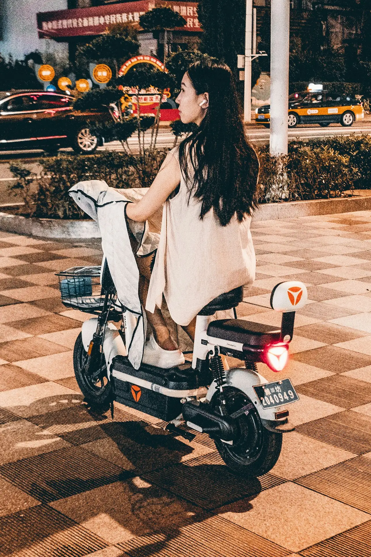 Mixed fleet of scooters and bikes lined up for rental
