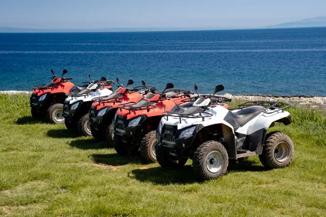 Quads lined up against the blue Adriatic